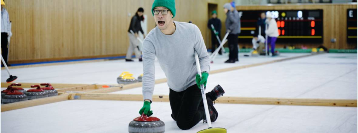 Johnny tries curling for the first time at a Drivemode team retreat.